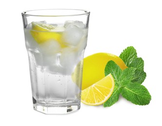 Glass with tasty lemonade, fresh ripe fruits and mint on white background