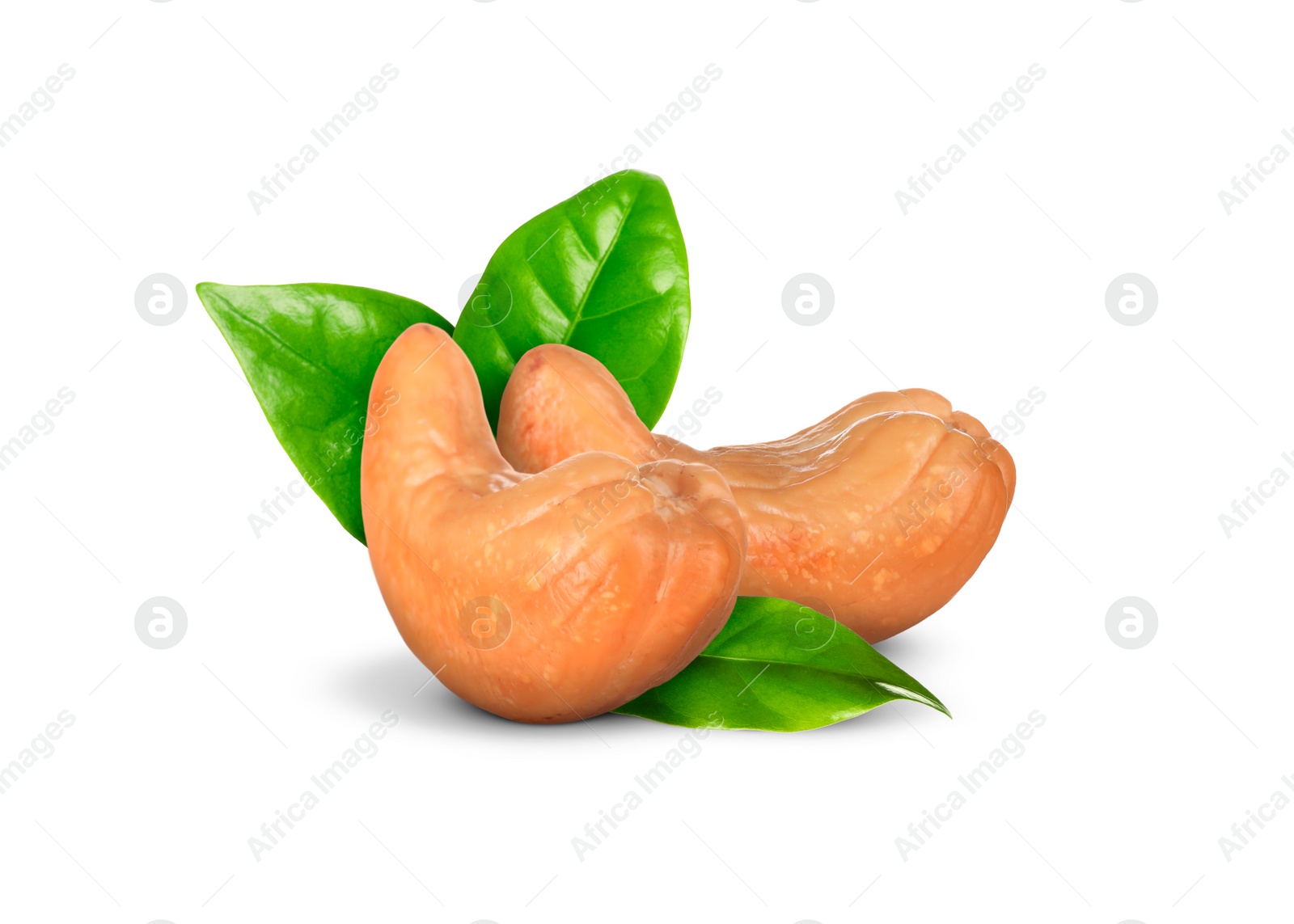 Image of Tasty cashew nuts and fresh green leaves on white background 