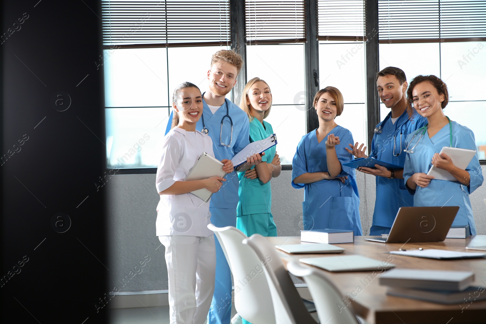 Photo of Group of smart medical students with gadgets in college