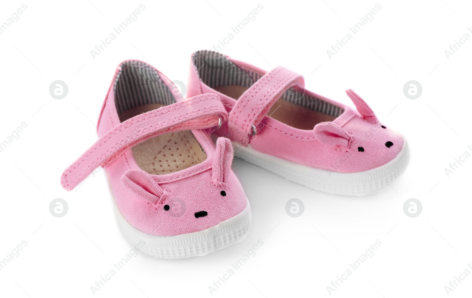 Photo of Cute pink child shoes isolated on white