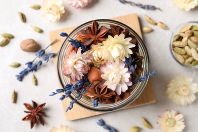 Photo of Aroma potpourri with different spices on white table, flat lay