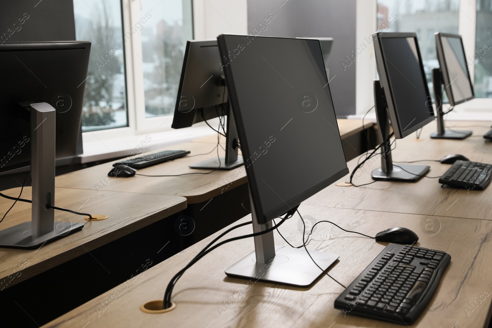 Photo of Many modern computers in open space office