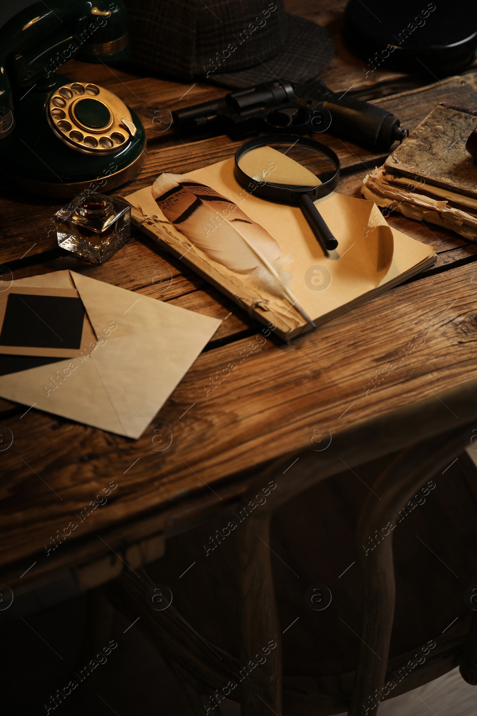 Photo of Composition with vintage detective items on wooden table