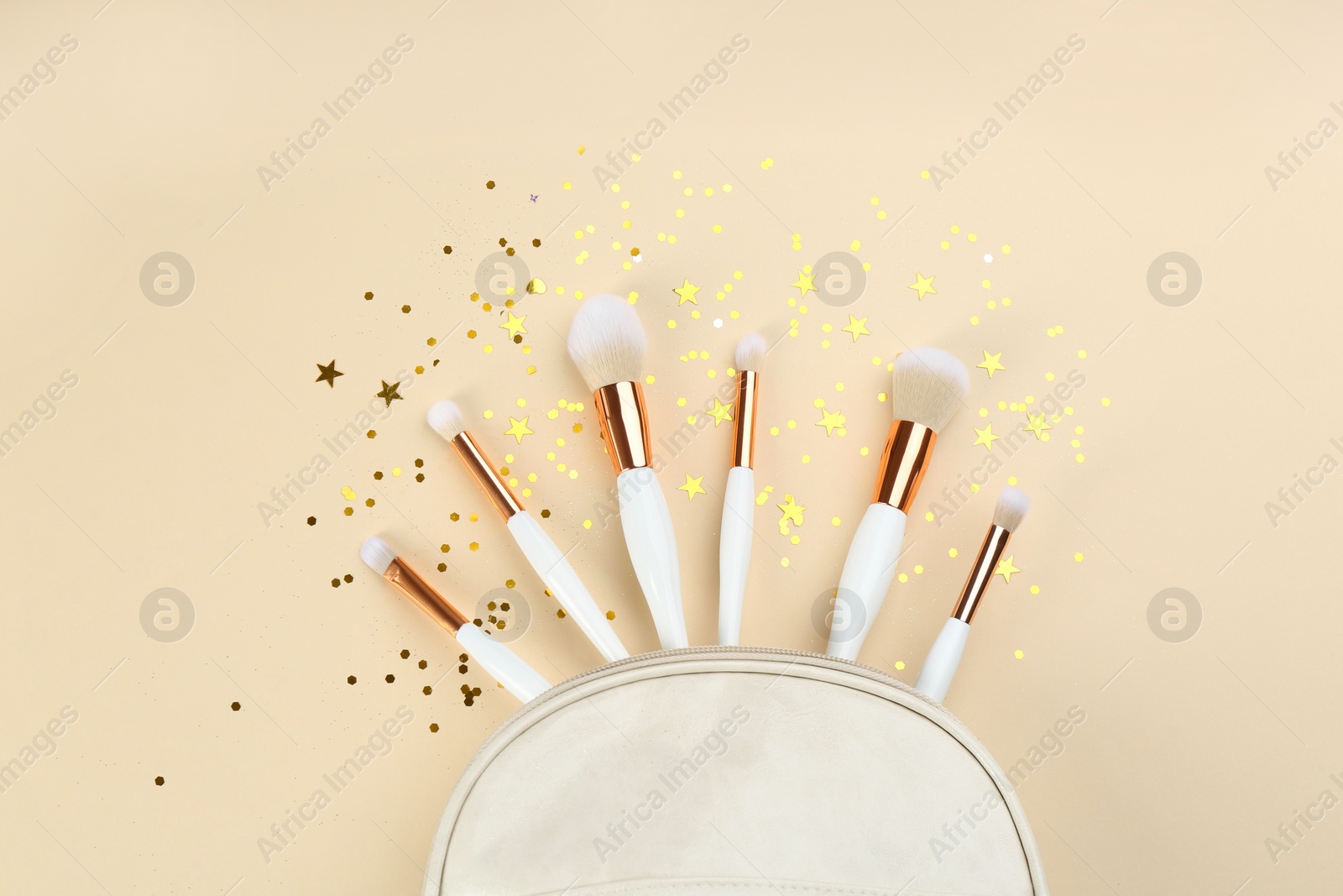 Photo of Flat lay composition with makeup brushes on beige background