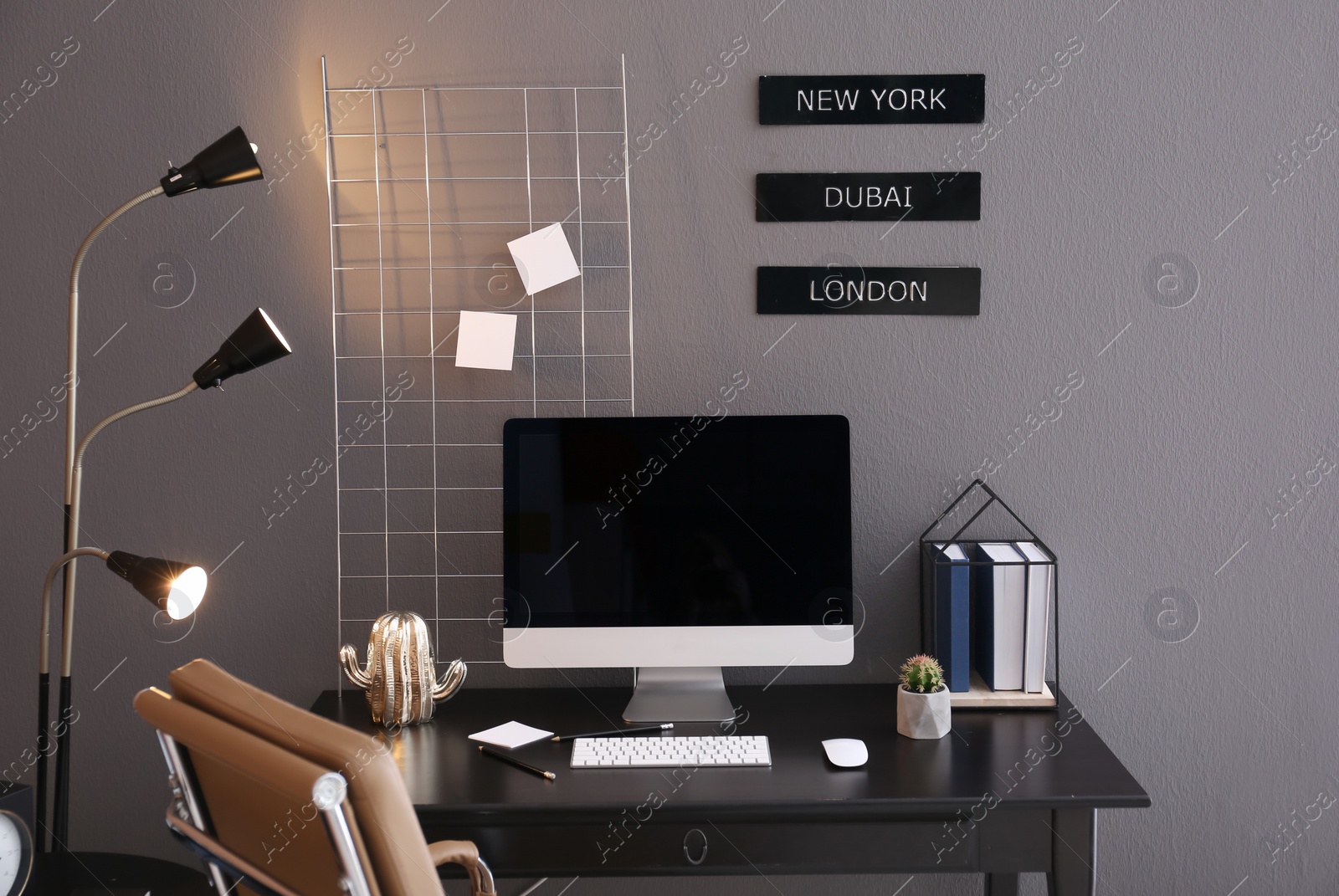 Photo of Comfortable workplace with computer on desk in home office