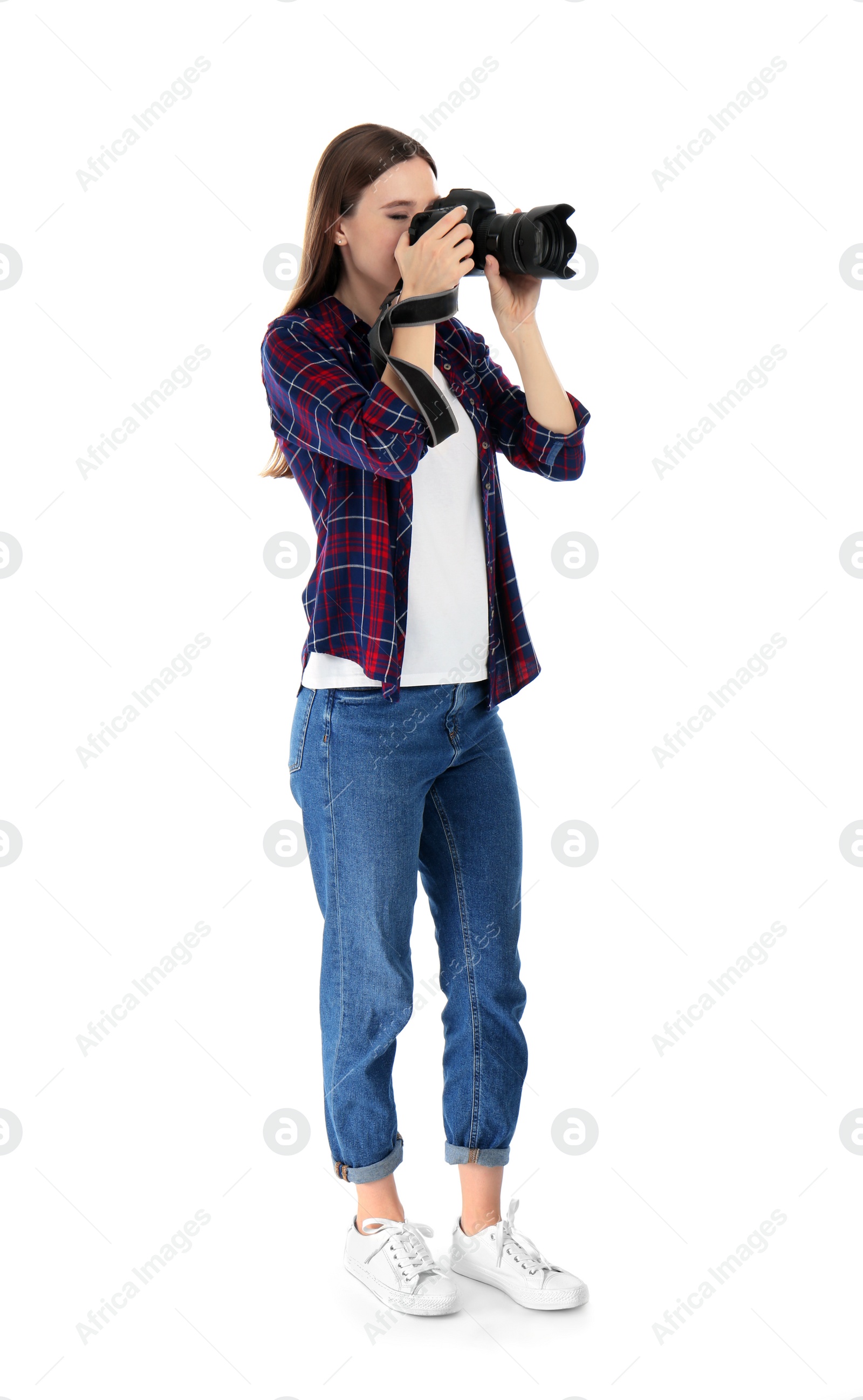 Photo of Professional photographer taking picture on white background