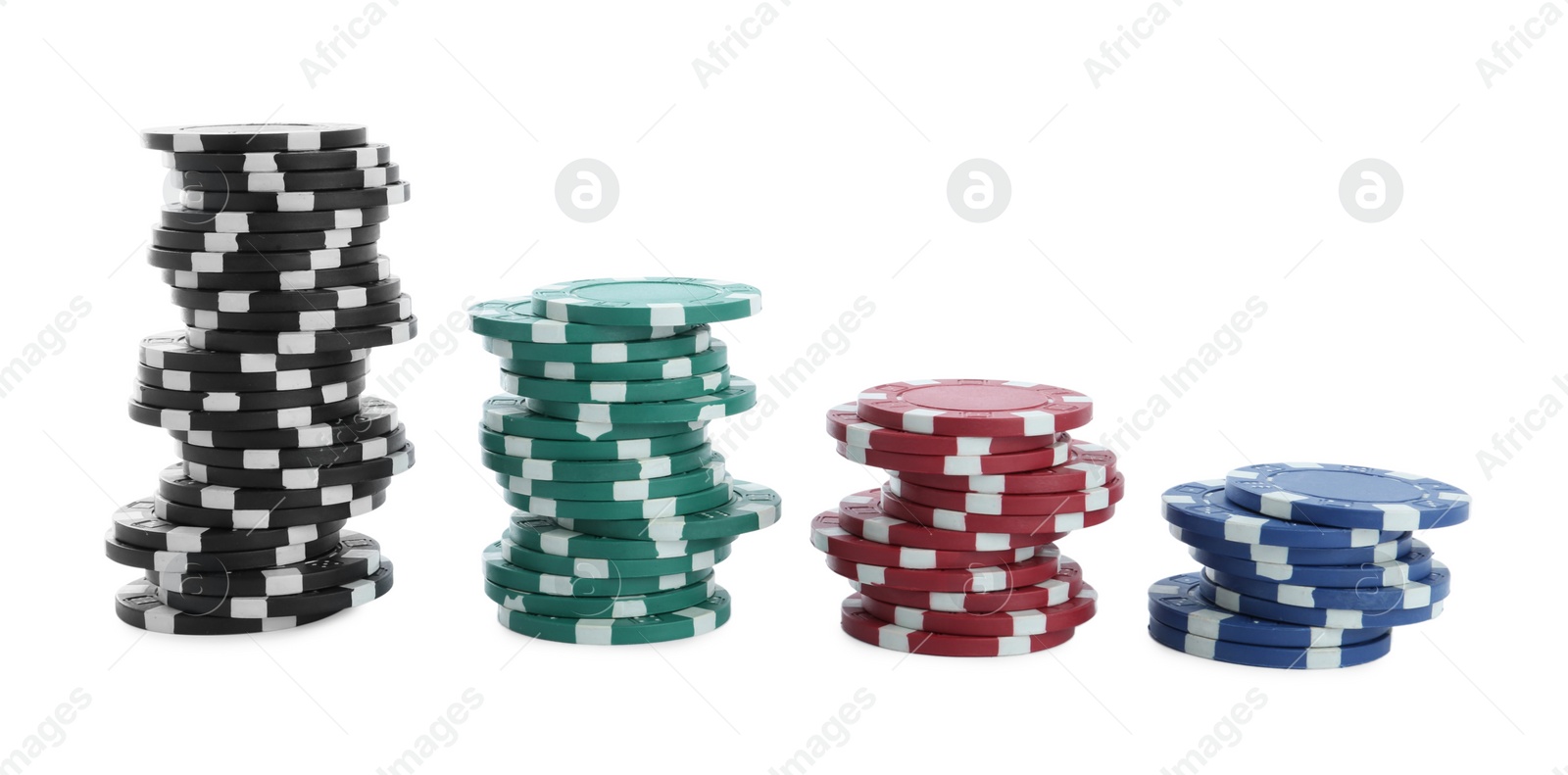 Photo of Stacks of casino poker chips on white background