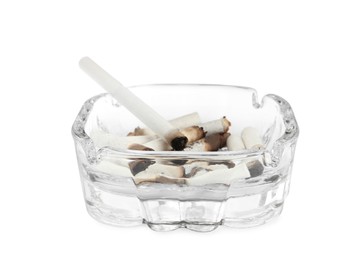 Glass ashtray with cigarette stubs isolated on white