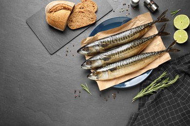 Flat lay composition with smoked fish on black table