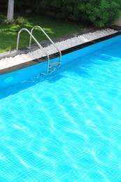 Modern swimming pool with stairs, outdoors