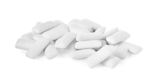 Photo of Pile of tasty chewing gums on white background