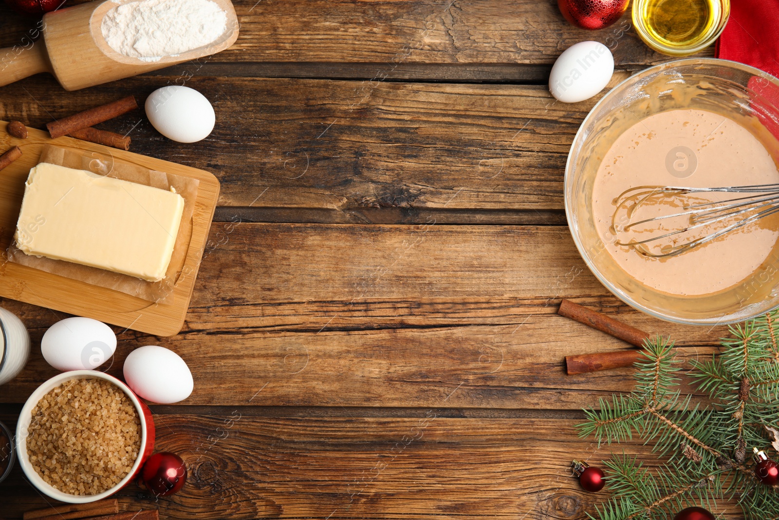 Flat lay composition with ingredients for traditional Christmas cake on wooden table. Space for text Photo of Flat lay composition with ingredients for traditional Christmas cake on wooden table. Space for text