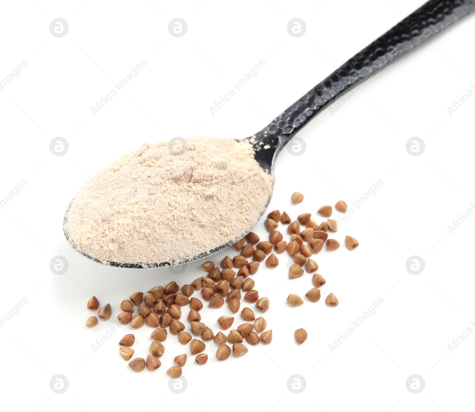 Photo of Spoon of buckwheat flour and grains on white background