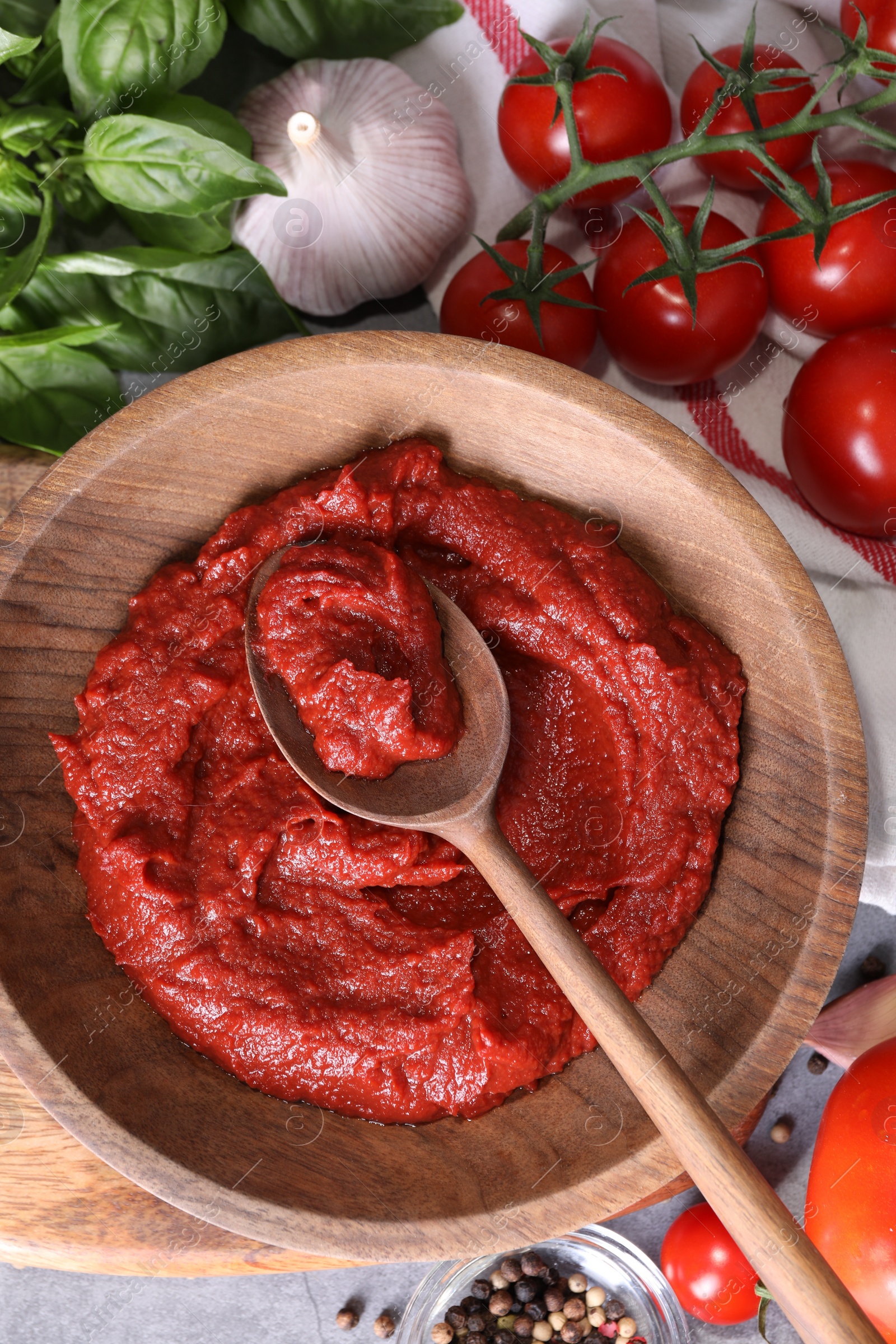 Photo of Tasty tomato paste and ingredients on table, flat lay