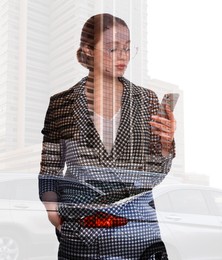 Image of Double exposure of businesswoman using phone and cityscape