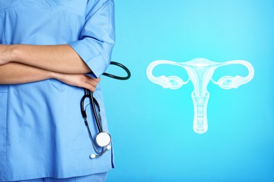 Image of Doctor and illustration of female reproductive system on light blue background, closeup