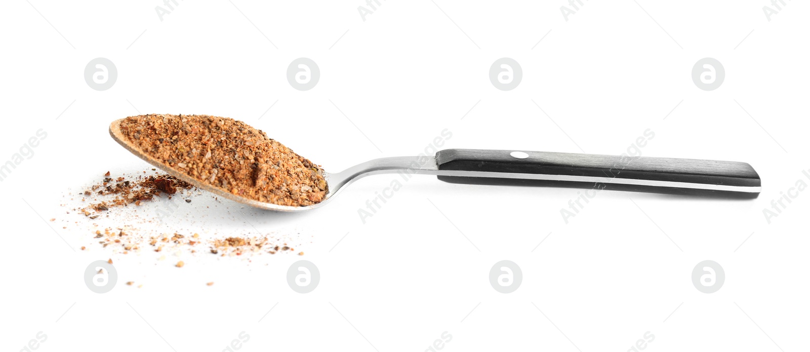 Photo of Spoon of ground pepper isolated on white