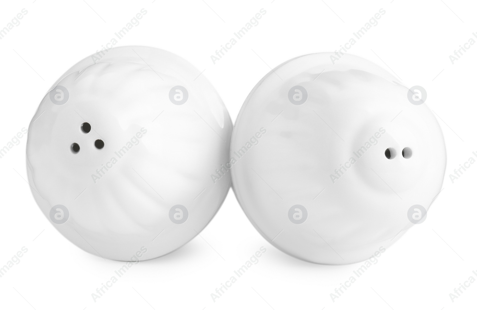 Photo of Salt and pepper shakers isolated on white