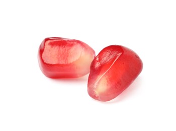 Photo of Juicy red pomegranate seeds on white background