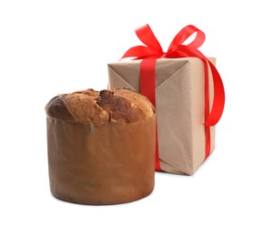 Delicious Panettone cake and gift box on white background. Traditional Italian pastry