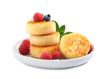 Photo of Delicious cottage cheese pancakes with berries on white background