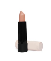 One stick of skin concealer isolated on white