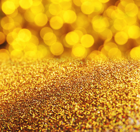 Gold glitter with bokeh effect as abstract background