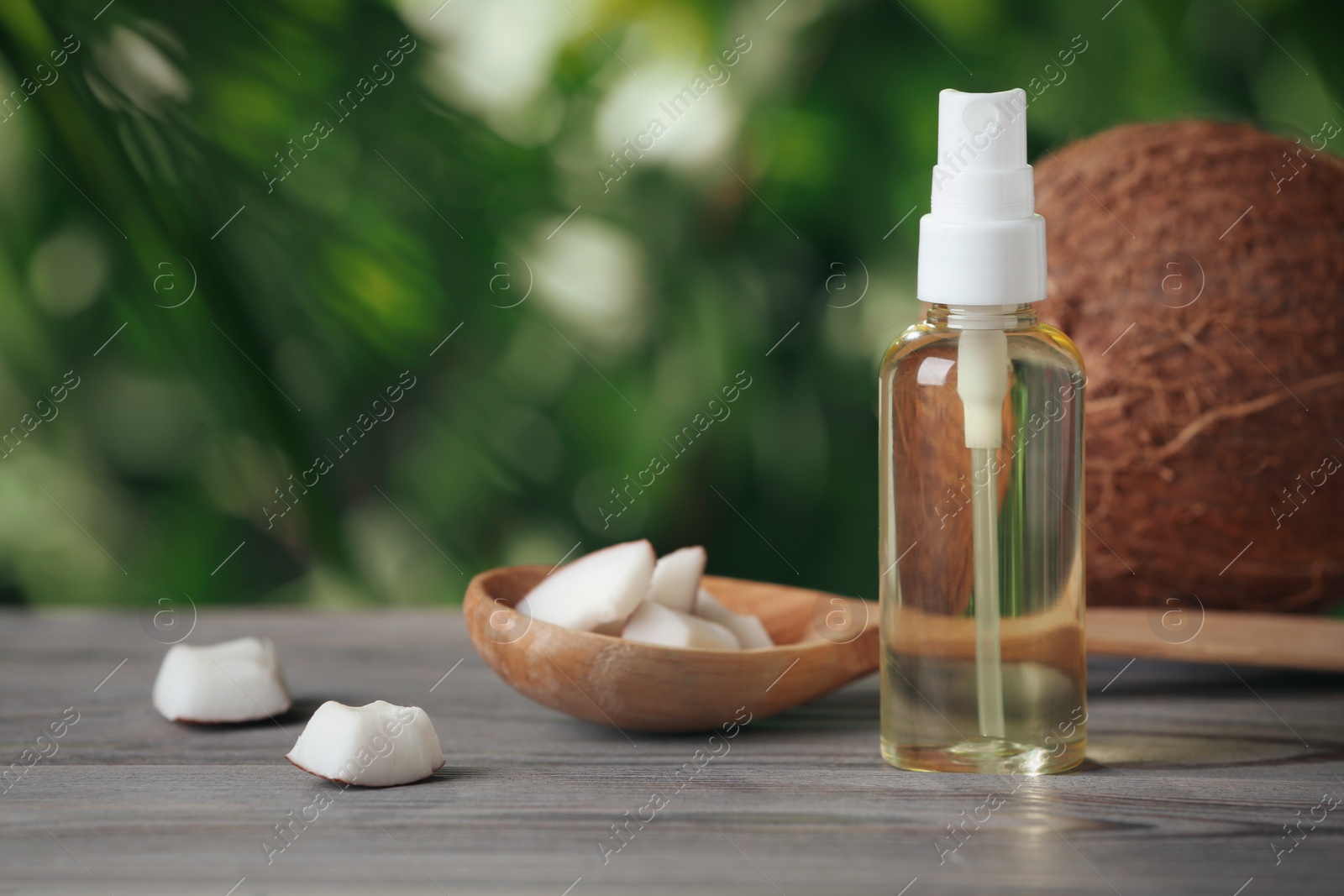 Photo of Coconut oil on wooden table, space for text