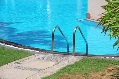 Modern swimming pool with stairs, outdoors