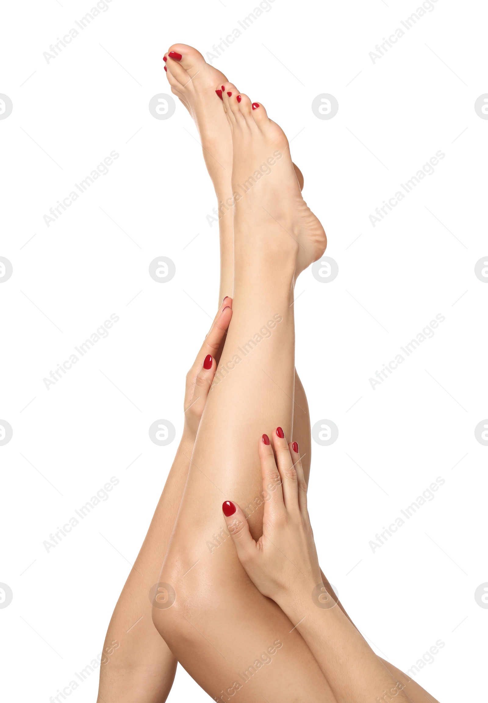 Photo of Woman with stylish red toenails after pedicure procedure isolated on white, closeup