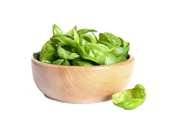 Fresh green basil leaves in wooden bowl isolated on white