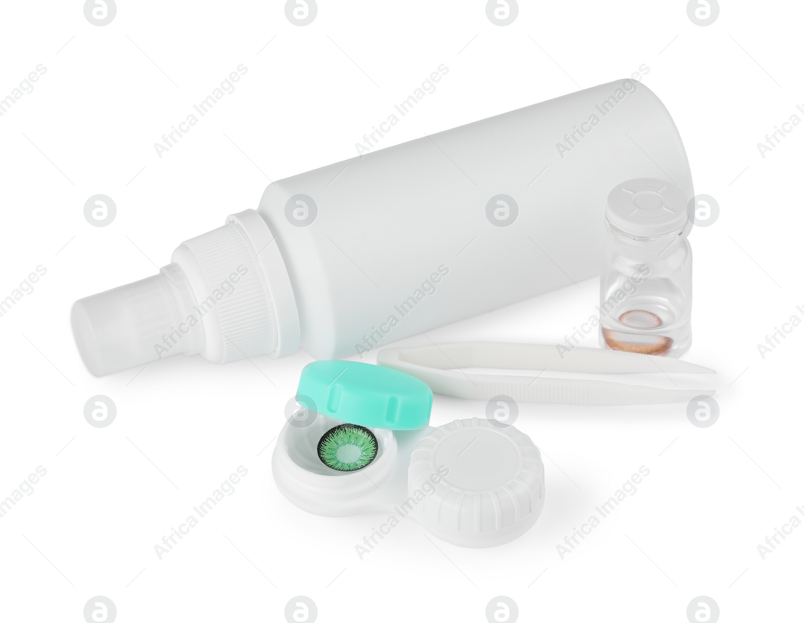 Photo of Containers with color contact lenses, tweezers and drops isolated on white