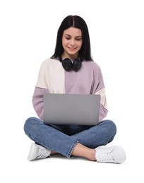 Photo of Smiling student with laptop sitting on white background