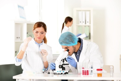 Scientists working in laboratory. Research and analysis