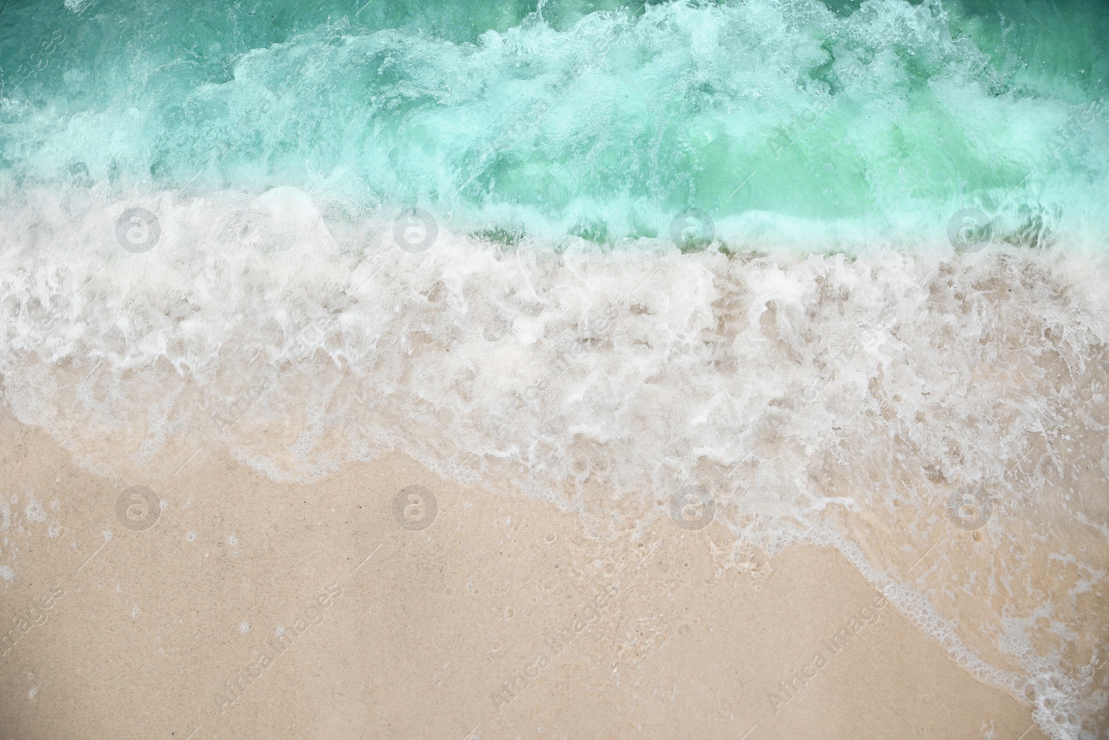 Photo of Beautiful view of sea tide on sandy beach. Summer vacation