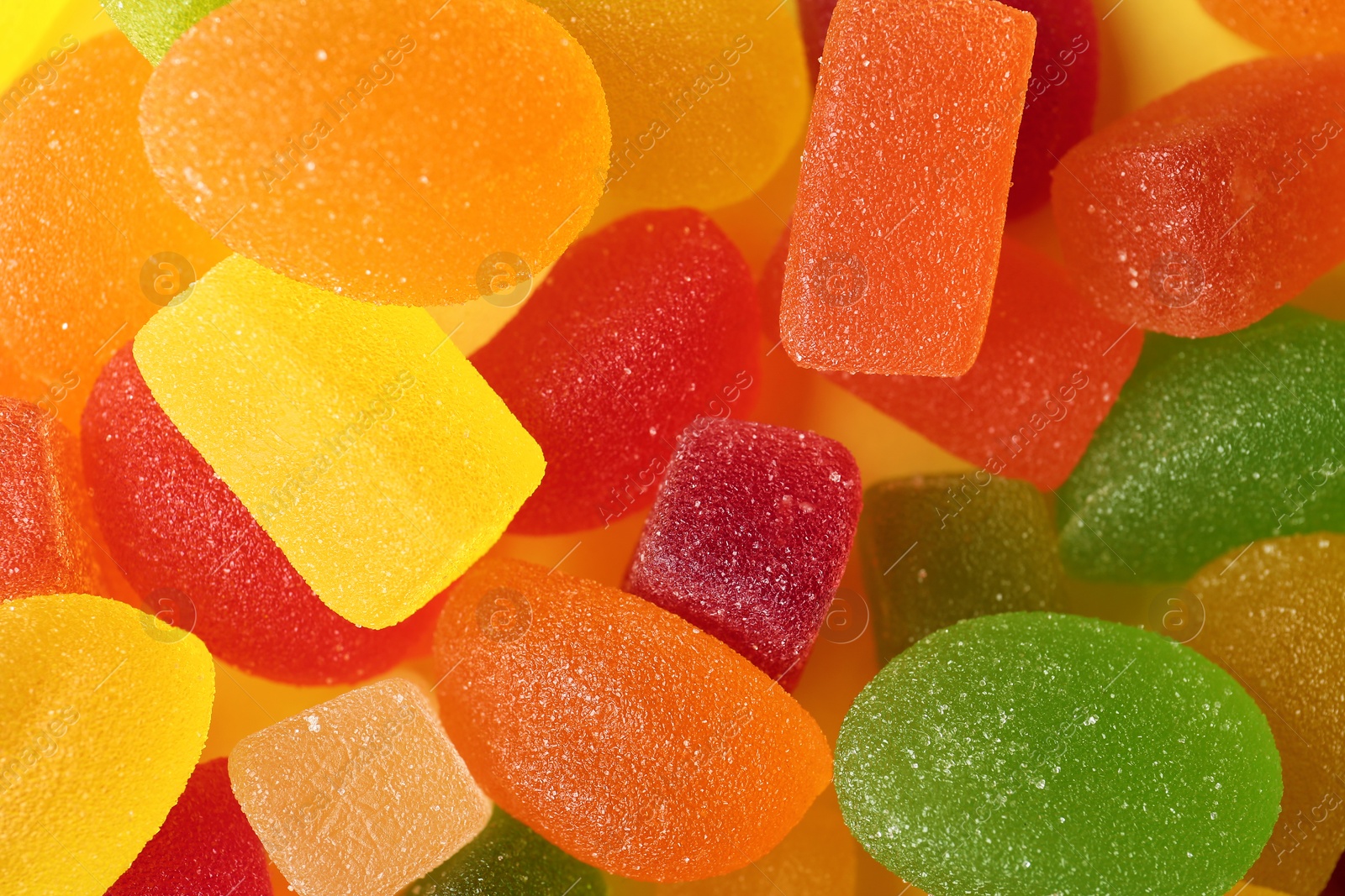 Photo of Tasty colorful jelly candies as background, top view