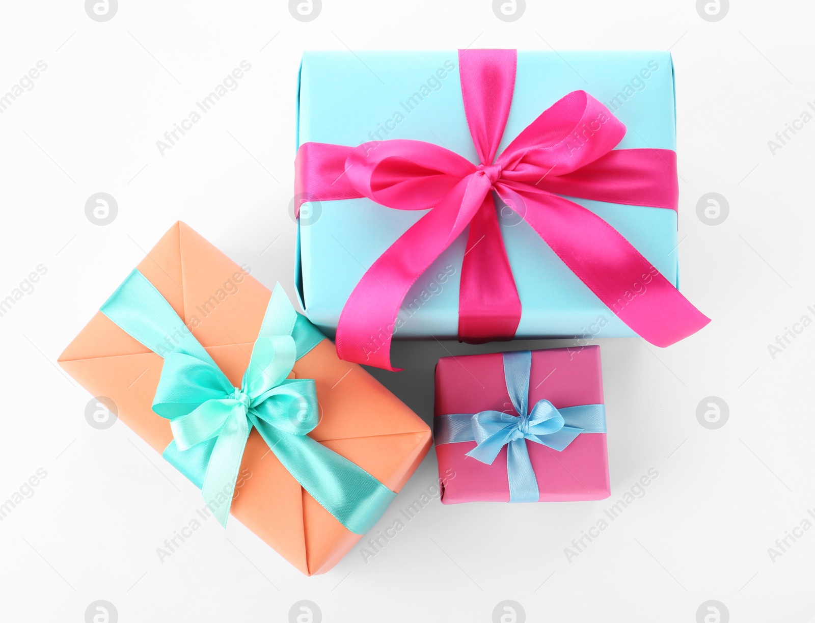 Photo of Beautiful gift boxes with ribbons on white background