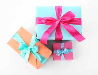 Photo of Beautiful gift boxes with ribbons on white background