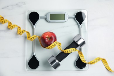 Photo of Flat lay composition with scales on white marble table