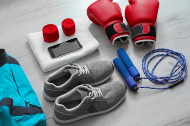 Photo of Composition with sports bag on wooden floor