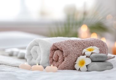 Photo of Beautiful spa composition on massage table in wellness center