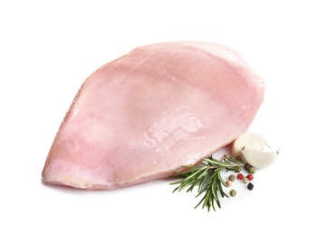 Raw turkey breast and ingredients on white background