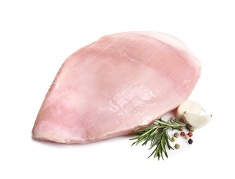 Photo of Raw turkey breast and ingredients on white background