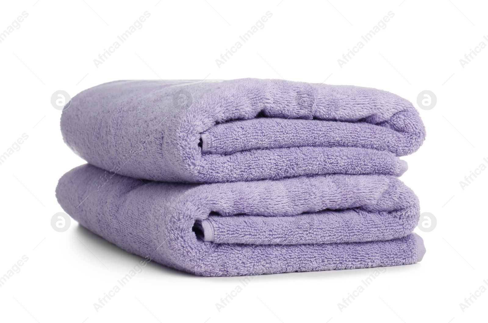 Photo of Folded soft terry towels on white background