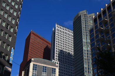 Exterior of beautiful buildings against blue sky, low angle view