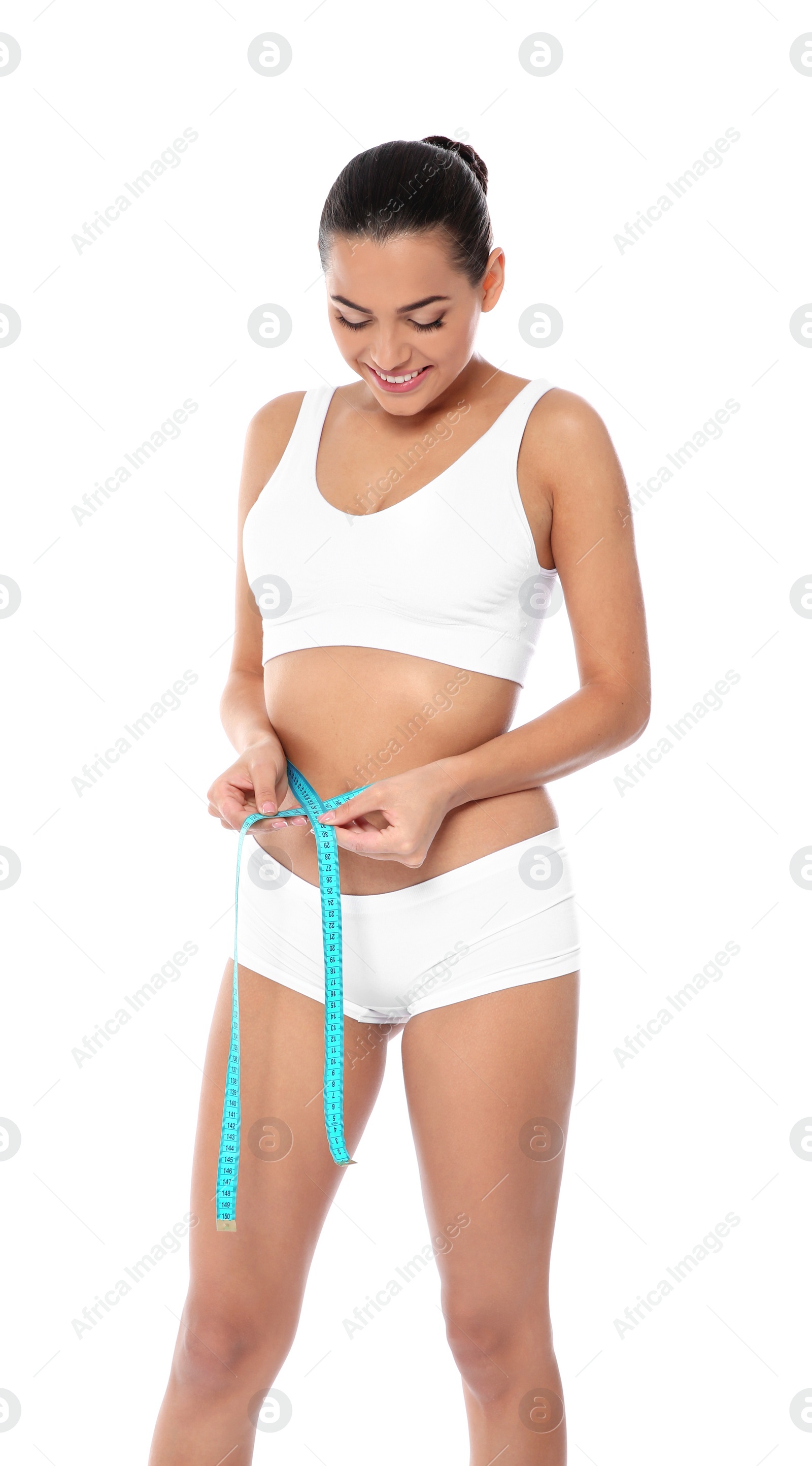 Photo of Slim woman measuring her waist on white background. Weight loss