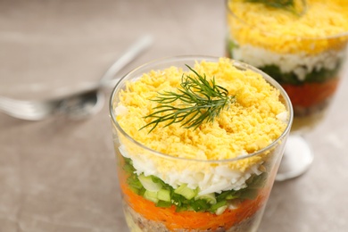 Traditional russian salad Mimosa on table, closeup