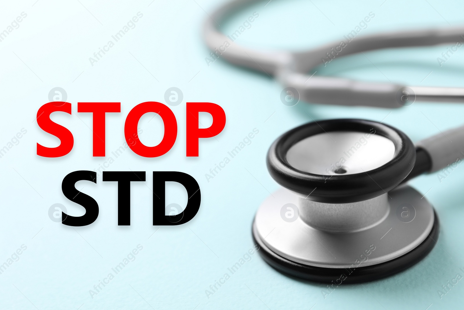 Image of Text STOP STD and stethoscope on light blue background, closeup