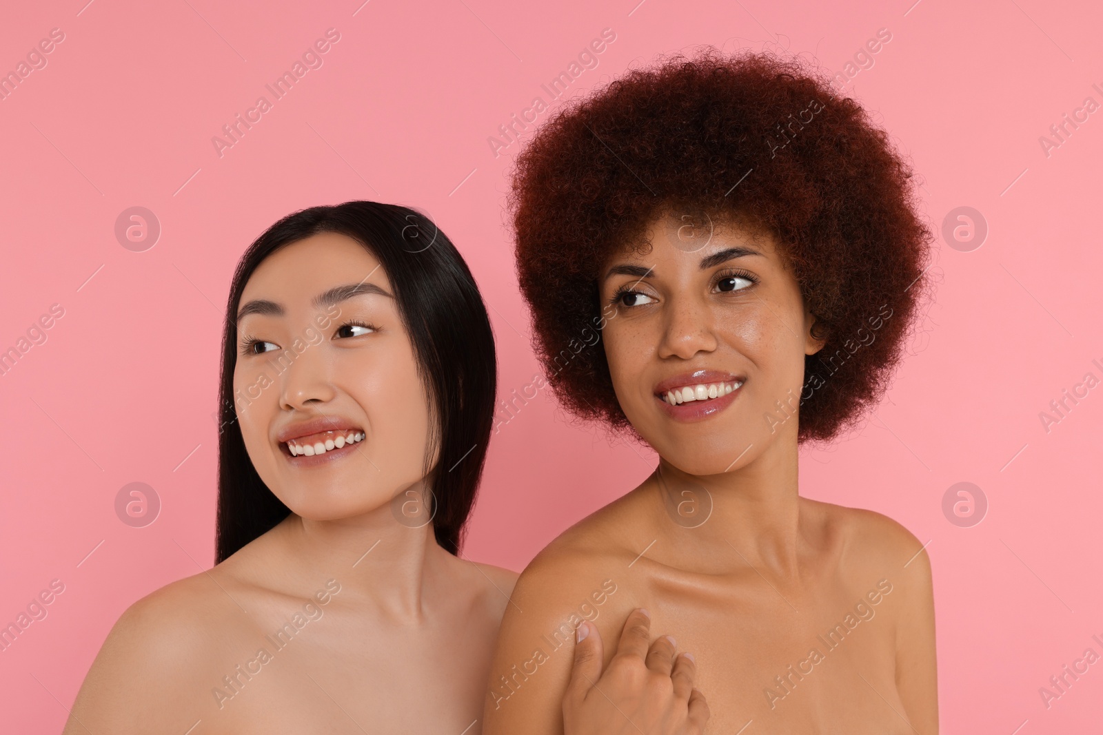 Photo of Portrait of beautiful young women on pink background