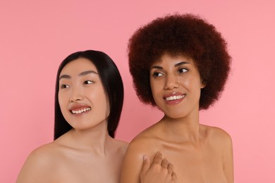 Photo of Portrait of beautiful young women on pink background